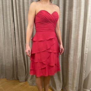 Dress never worn. 

Color: bright pink. 

Comes with removable straps.